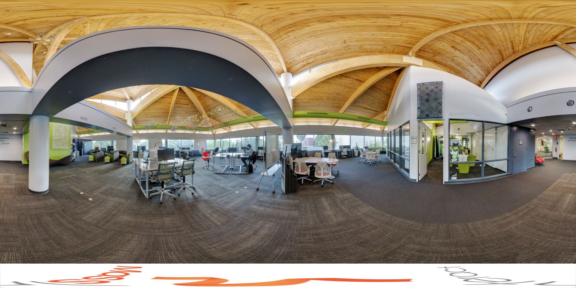 Modern study area in Evans Library with wooden arched ceilings, workstations, and curved architectural elements, enhancing a creative learning environment